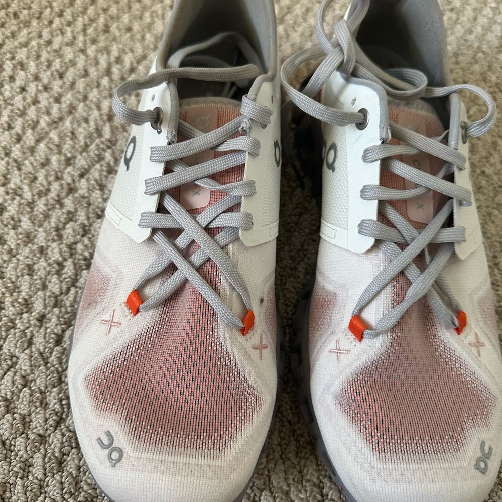 On Running White and Coral Sneakers